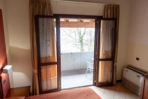 Postel nebo postele na pokoji v ubytování Hotel mariuccia