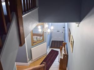 an overhead view of a hallway with a staircase at Shorley Lodge in Keswick