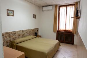 Postel nebo postele na pokoji v ubytování Hotel mariuccia