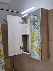 a bathroom with a shower with a glass door at Olive Tree Apartment in Asprovalta +19 photos