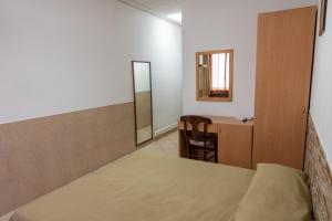 Postel nebo postele na pokoji v ubytování Hotel mariuccia