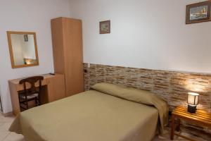 Postel nebo postele na pokoji v ubytování Hotel mariuccia