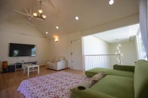 A television and/or entertainment centre at Yashodhara Grove, Bagepalli