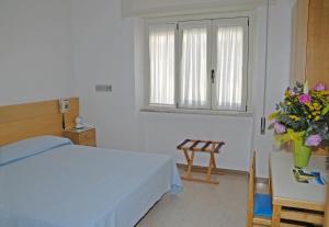 Voodi või voodid majutusasutuse Albergo La Sirenella toas
