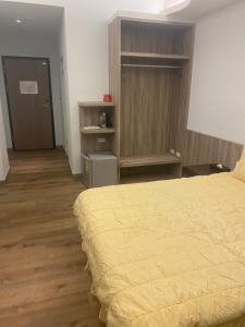 Postel nebo postele na pokoji v ubytování Shun Cheng Hotel