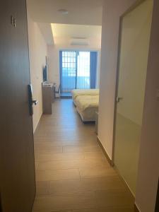Postel nebo postele na pokoji v ubytování Shun Cheng Hotel