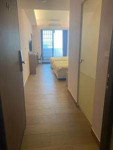 Postel nebo postele na pokoji v ubytování Shun Cheng Hotel