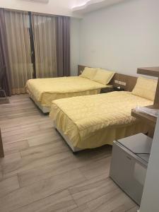 Postel nebo postele na pokoji v ubytování Shun Cheng Hotel