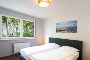 Ένα ή περισσότερα κρεβάτια σε δωμάτιο στο Ferienhaus CARPE DIEM in Gager WE 02 direkt am Bodden
