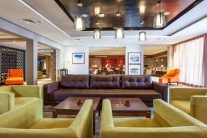 a living room with a couch and chairs at Dunes d'Or Ocean Club in Agadir