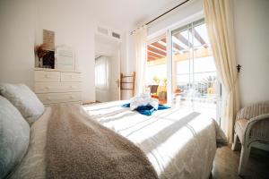 Ένα ή περισσότερα κρεβάτια σε δωμάτιο στο Villa Dahi Almerimar para 10 personas con Piscina privada, Barbacoa, Bar y Vistas al mar +72 φωτογραφίες