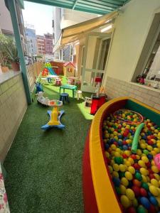 a childrens play area with a pool of balls at Hotel ABC in Riccione