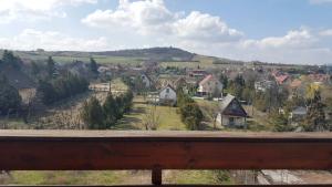a view of a town with houses and trees at Manoka Guest House in Mogyoród
