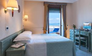 A bed or beds in a room at Parco Aurora Terme