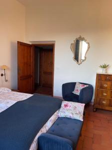 Postel nebo postele na pokoji v ubytování Casa le Rondini Toscana