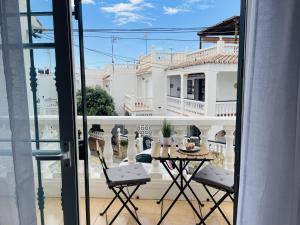 a view of a balcony with a table and chairs at Casa Encanto de Nerja by At Home costa del sol in Nerja