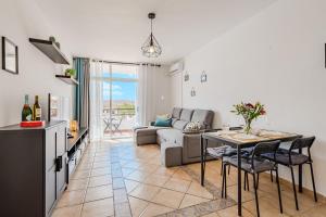 a living room with a couch and a table at Marina Palace with Swimming Pool in Adeje