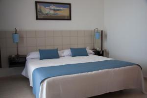 Postel nebo postele na pokoji v ubytování Hotel Sicania