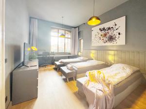 a bedroom with a bed and a living room at Platanenblick in Schönebeck an der Elbe in Schönebeck +5 photos