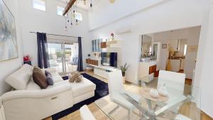 a living room with a white couch and a glass table at Casa NY - A Murcia Holiday Rentals Property in Roldán