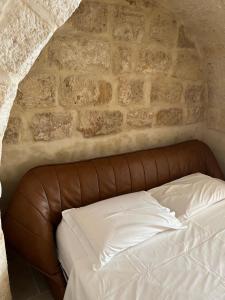 Ένα ή περισσότερα κρεβάτια σε δωμάτιο στο Dimora Grottacielo