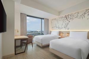 Postel nebo postele na pokoji v ubytování Fairfield by Marriott Bekasi