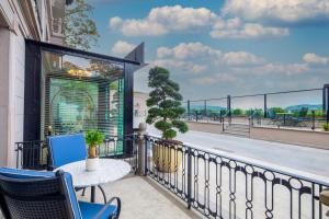 a balcony with a table and chairs and a view at MFB Tarabya Hotel in Istanbul
