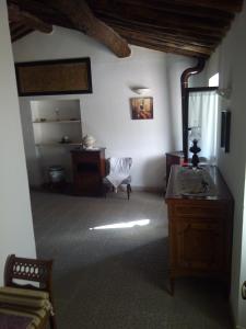 a room with a table and a chair in a room at Agriturismo Locanda del Papa in La Spezia