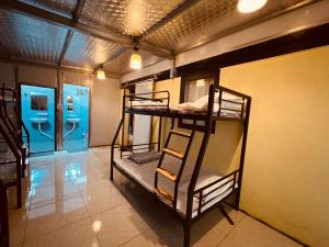 a room with two bunk beds and a bathroom at Fish Farm Homestay in Yên Bái +97 photos
