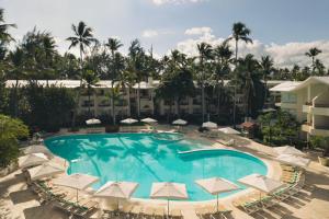 an overhead view of a swimming pool with umbrellas at Impressive Punta Cana - All Inclusive in Punta Cana