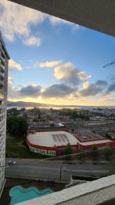 a view of a stadium with a building and a city at Departamento Concepción in Concepción