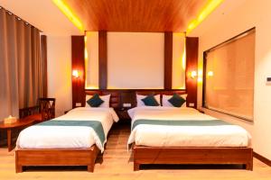 Krevet ili kreveti u jedinici u okviru objekta Galaxy Garden Resort