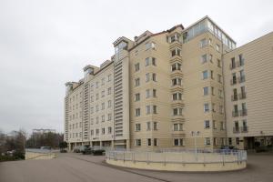a large building on a street next to a building at Unit 22 Warszawa Stadion Narodowy Park Skaryszewski in Warsaw