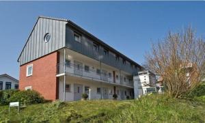 a large building on top of a hill at Haus Blinkfüer in Wangerooge