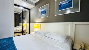 Postel nebo postele na pokoji v ubytování HOTEL PERDIZES - FLAT Executivo - 1204