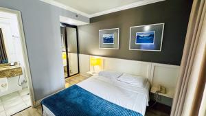 Postel nebo postele na pokoji v ubytování HOTEL PERDIZES - FLAT Executivo - 1204
