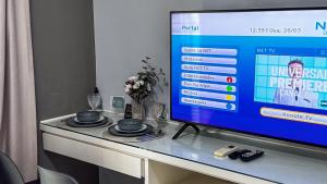 TV a/nebo společenská místnost v ubytování HOTEL PERDIZES - FLAT Executivo - 1204