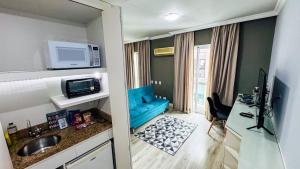 Kuchyň nebo kuchyňský kout v ubytování HOTEL PERDIZES - FLAT Executivo - 1204