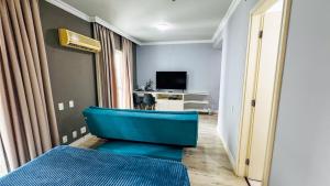 TV a/nebo společenská místnost v ubytování HOTEL PERDIZES - FLAT Executivo - 1204