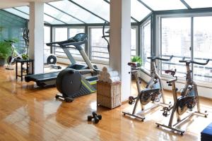 a gym with a bunch of exercise bikes in a room at NH Córdoba Panorama in Córdoba
