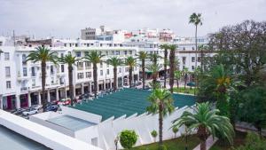an overhead view of a building with palm trees at Az Hotel Rabat Centre in Rabat