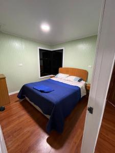 Postel nebo postele na pokoji v ubytování Cabaña Tres Cipreses
