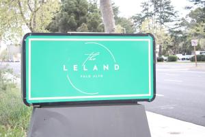 a blue sign on the side of a street at Leland Hotel Palo Alto in Palo Alto