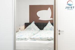 Postel nebo postele na pokoji v ubytování Haus Sylke 137 - Ferienwohnung 7