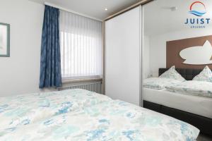 Postel nebo postele na pokoji v ubytování Haus Sylke 137 - Ferienwohnung 7