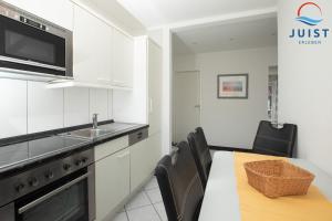 Kuchyň nebo kuchyňský kout v ubytování Haus Sylke 137 - Ferienwohnung 7 + 13 fotografií