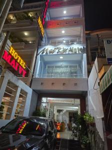 a car parked in front of a building at MAI VY Hotel in Phan Thiet