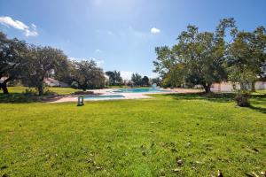 a view of a park with a swimming pool at Lovely And New Apartment In Oura in Albufeira
