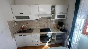 Kuchyňa alebo kuchynka v ubytovaní Hostel Split