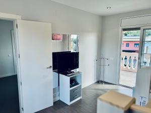 TV a/nebo společenská místnost v ubytování Hauzify I Casa Sa Calma